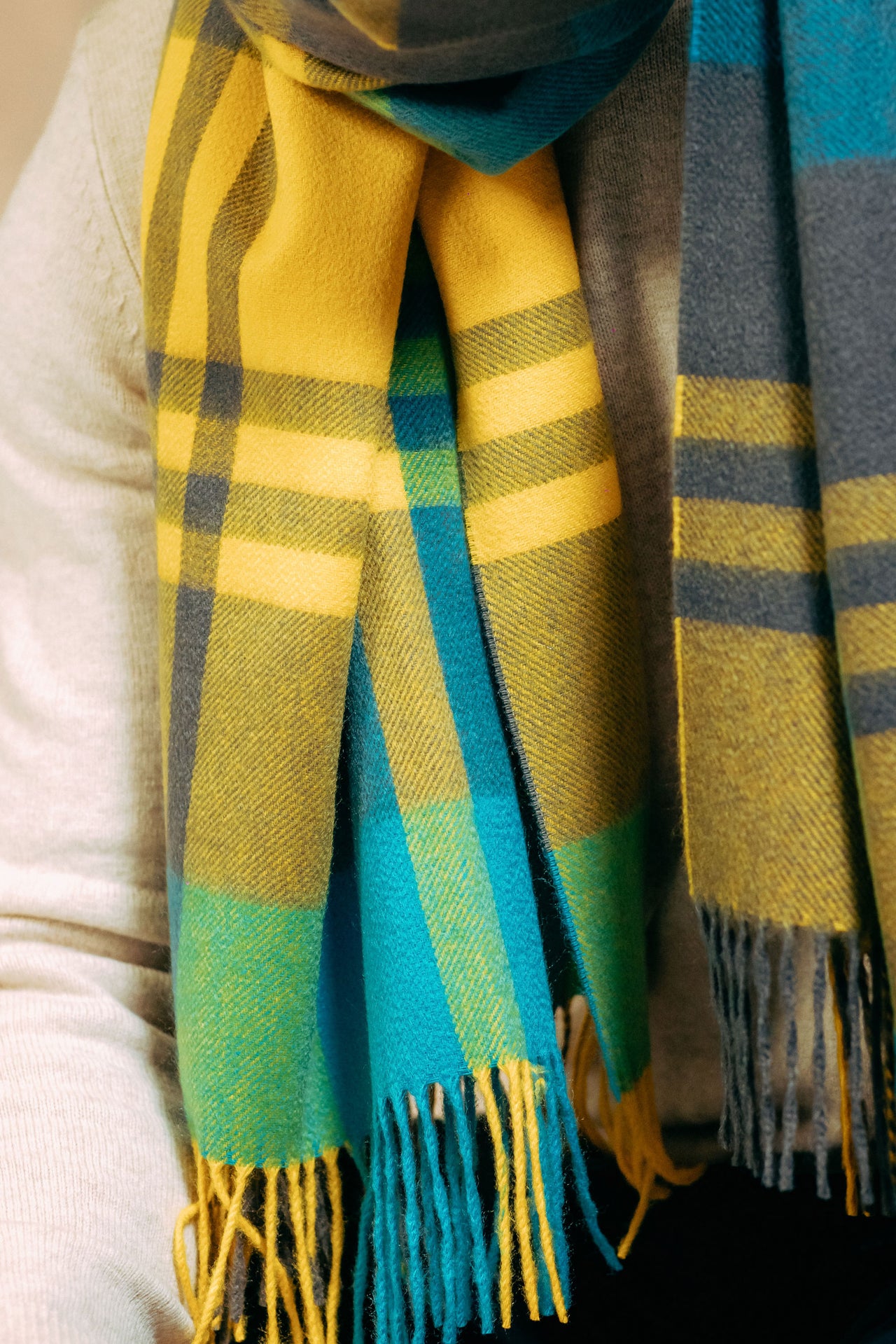 Plaid scarf with yellow, green, and blue colors