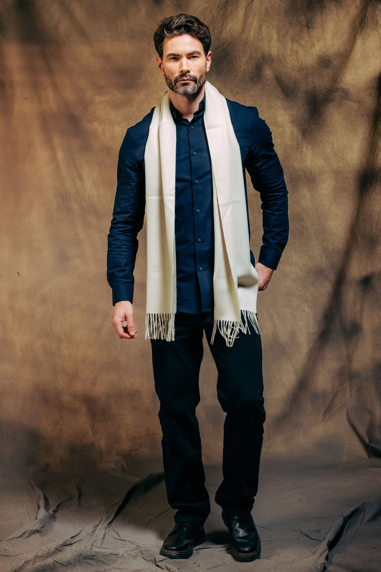 Male model wearing 100% Lambswool Scarf - Cream