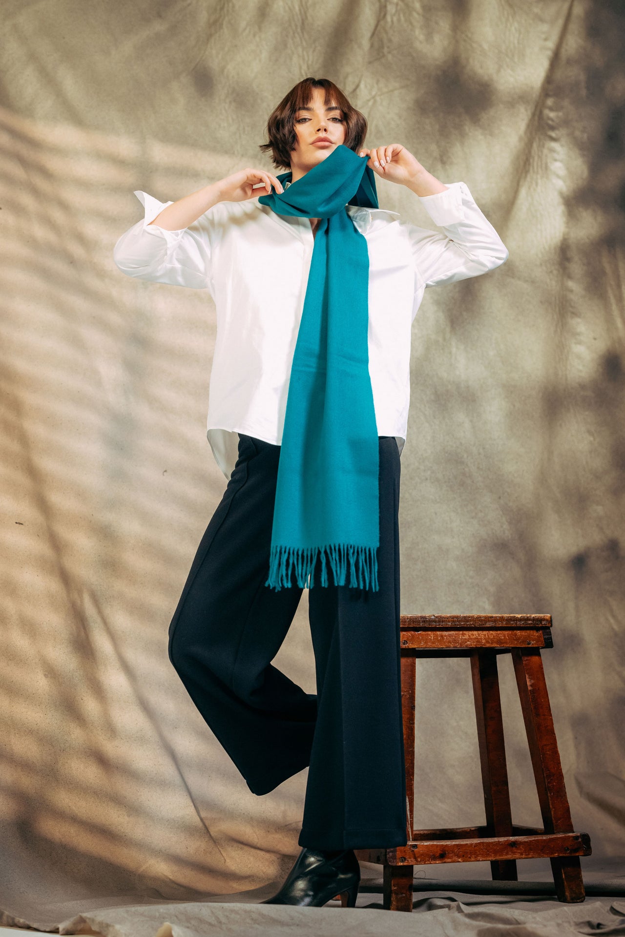 British Female model wearing Classic Plain 100% Lambswool Scarf - Turquoise