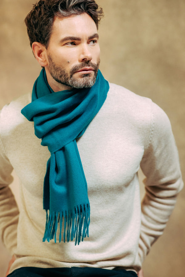 British Male model wearing Classic Plain 100% Lambswool Scarf - Turquoise